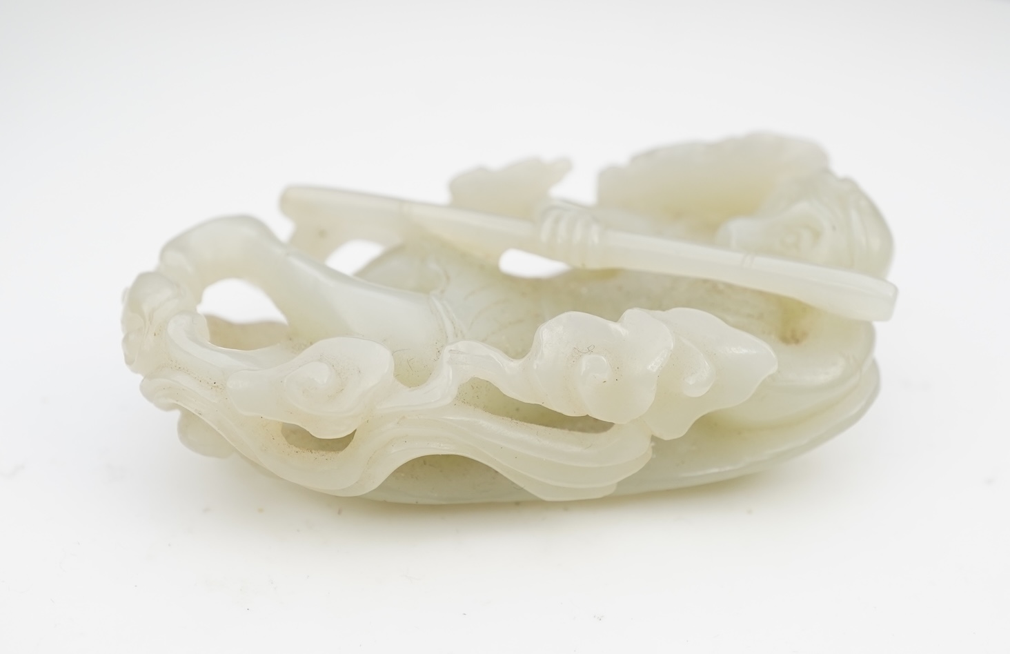 A Chinese pale celadon jade carving of Sun Wukong, the Monkey King, 18th/19th century